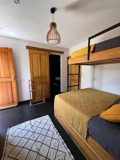 a bedroom with a bed furniture and a window