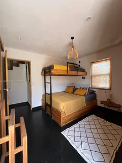 a view of balcony with furniture and wooden floor