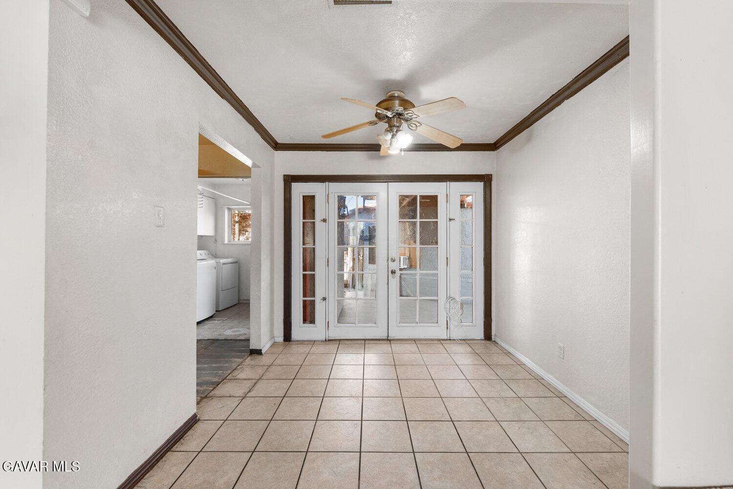 44221 4th Street East Lancaster, CA 93535 - Photo 9 of 68 a view of empty room with wooden floor and fan