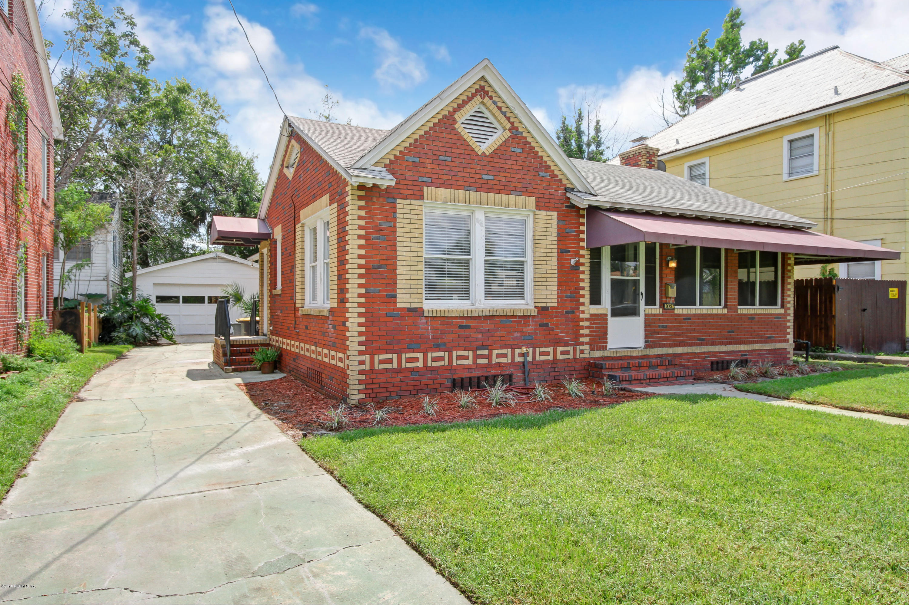 front view of a house with a yard