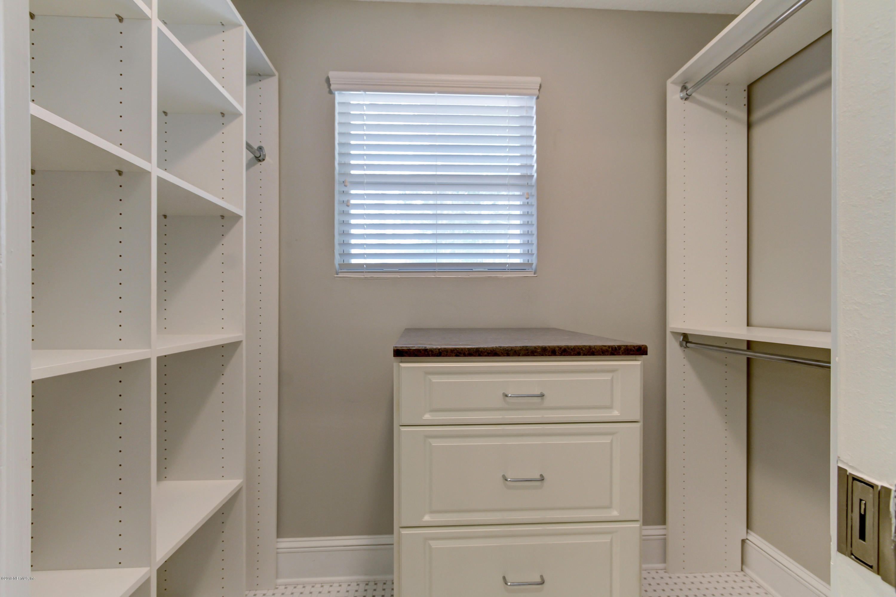 1026 Riviera Street Jacksonville, FL 32207 - Photo 13 of 48 a view of walk in closet with empty racks