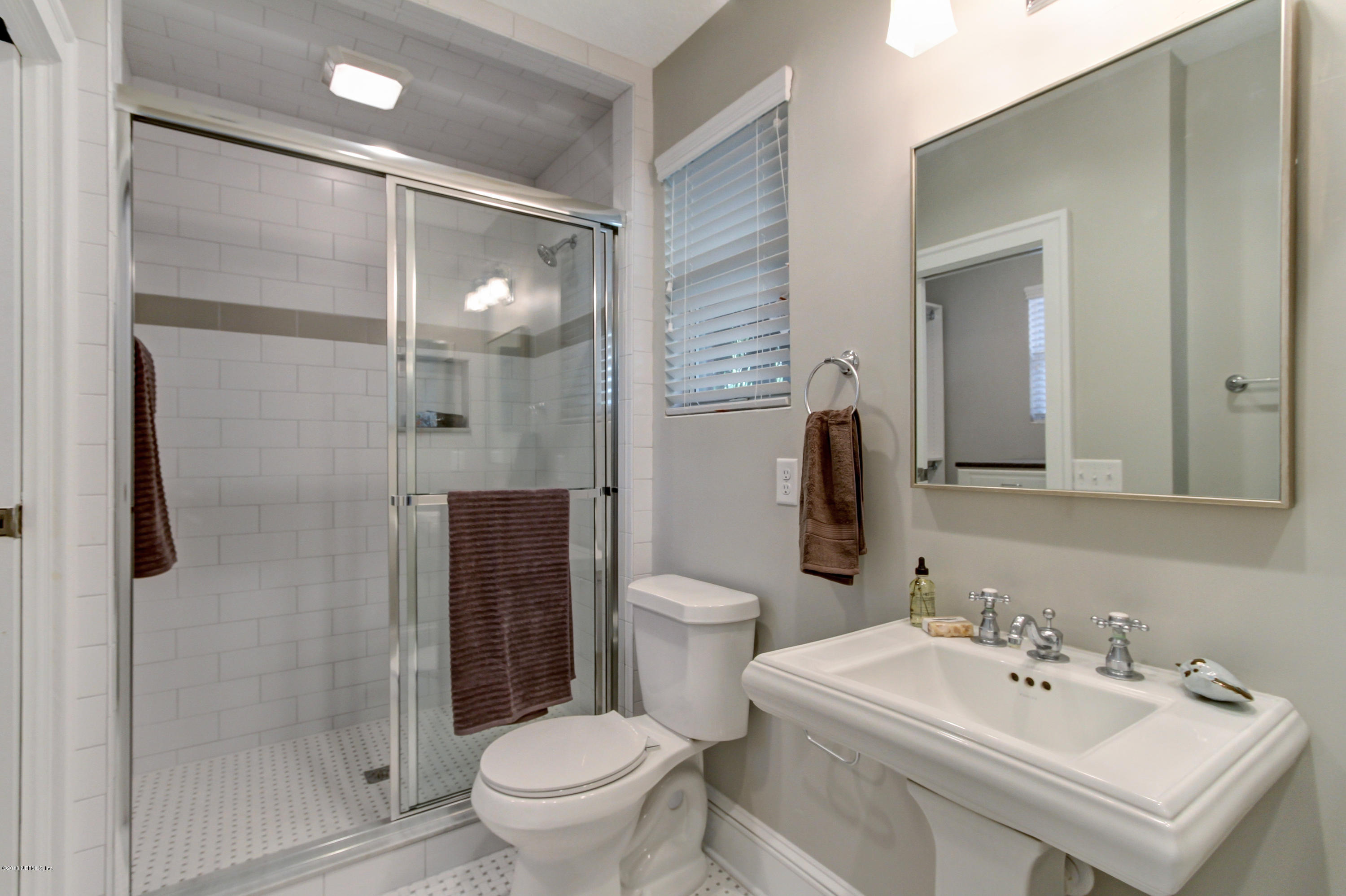 1026 Riviera Street Jacksonville, FL 32207 - Photo 14 of 48 a bathroom with a sink toilet and shower