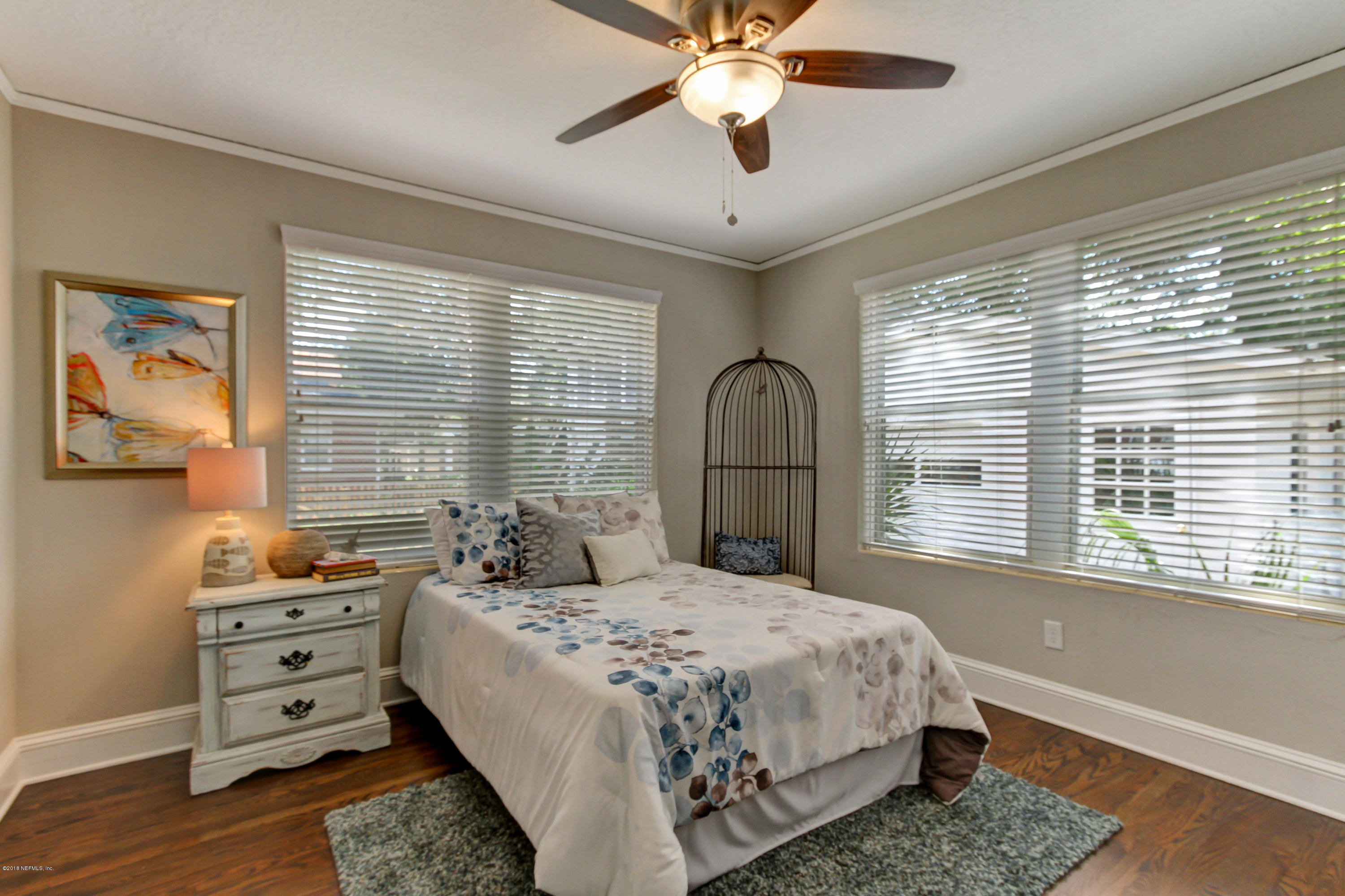 1026 Riviera Street Jacksonville, FL 32207 - Photo 16 of 48 a bedroom with a large bed and a window