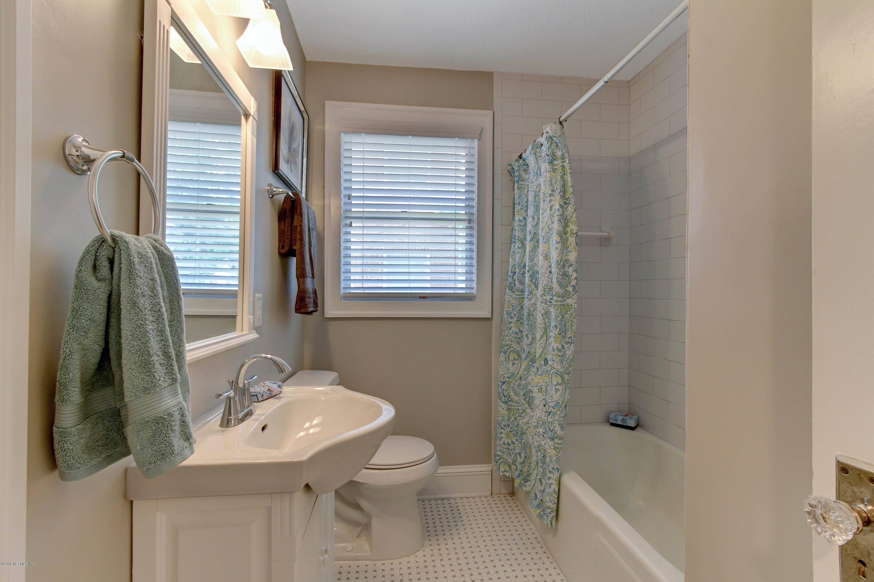 1026 Riviera Street Jacksonville, FL 32207 - Photo 17 of 48 a bathroom with a sink toilet and shower