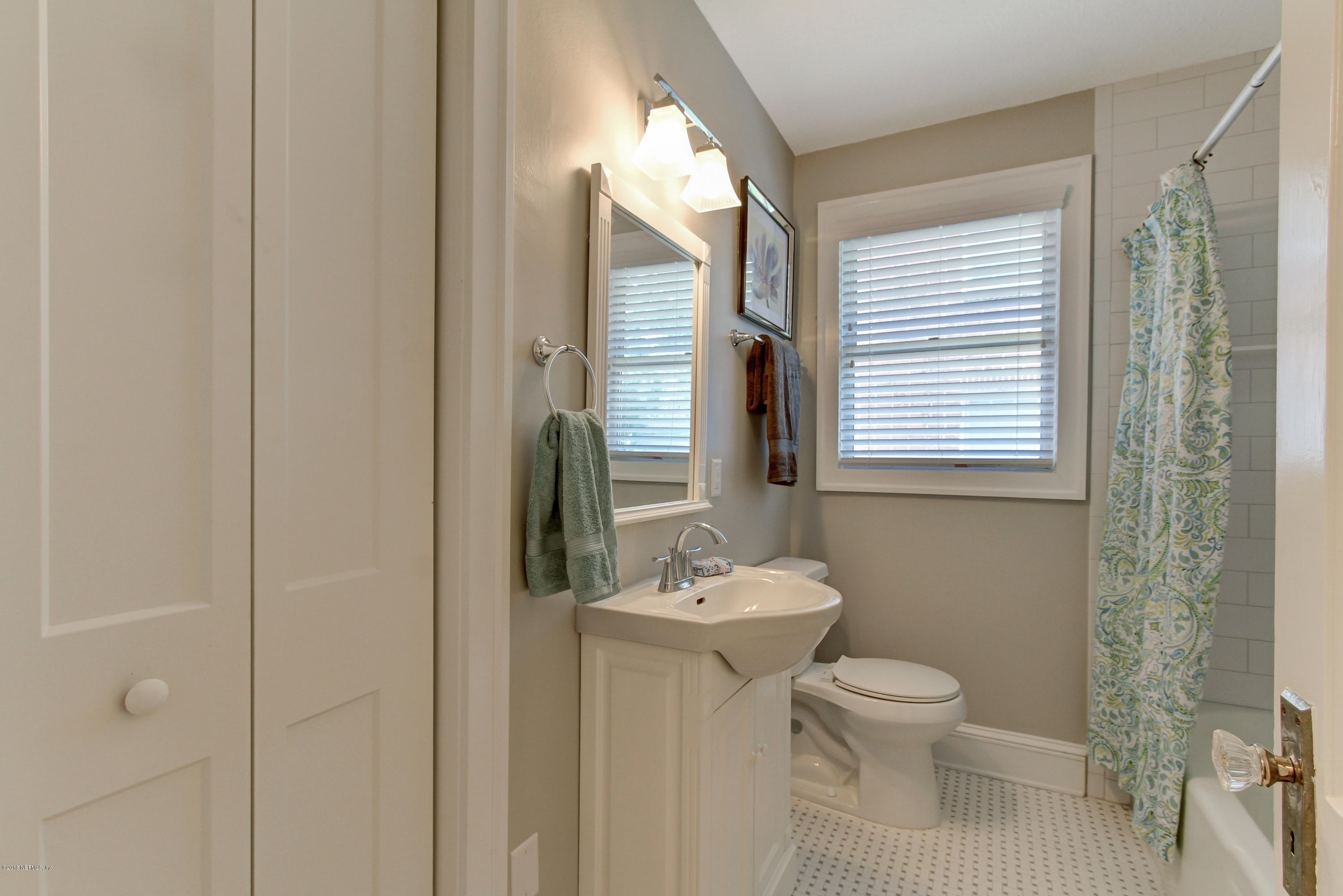1026 Riviera Street Jacksonville, FL 32207 - Photo 18 of 48 a bathroom with a sink a toilet and shower