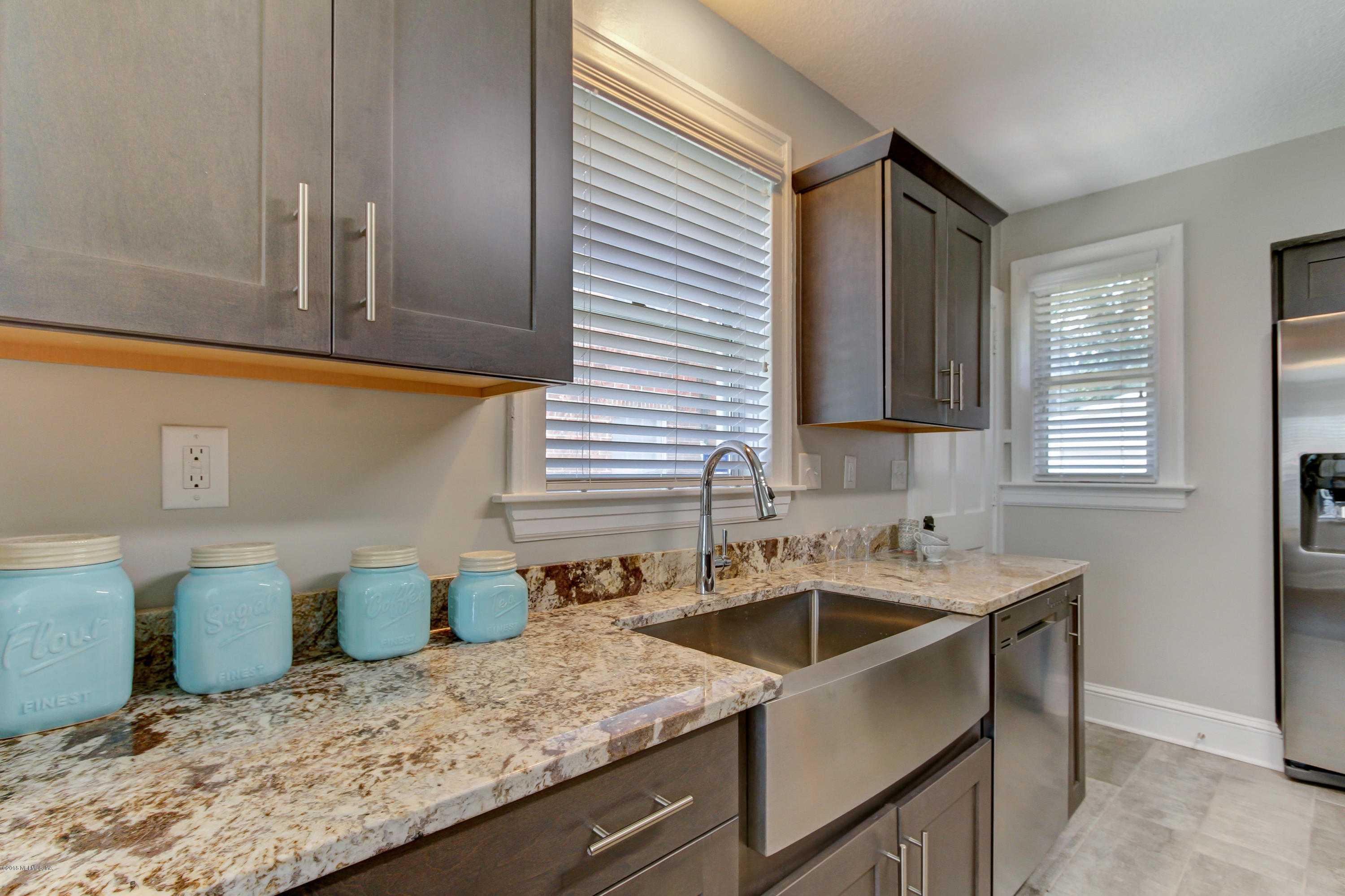 1026 Riviera Street Jacksonville, FL 32207 - Photo 21 of 48 a kitchen that has a sink and a white wooden cabinets