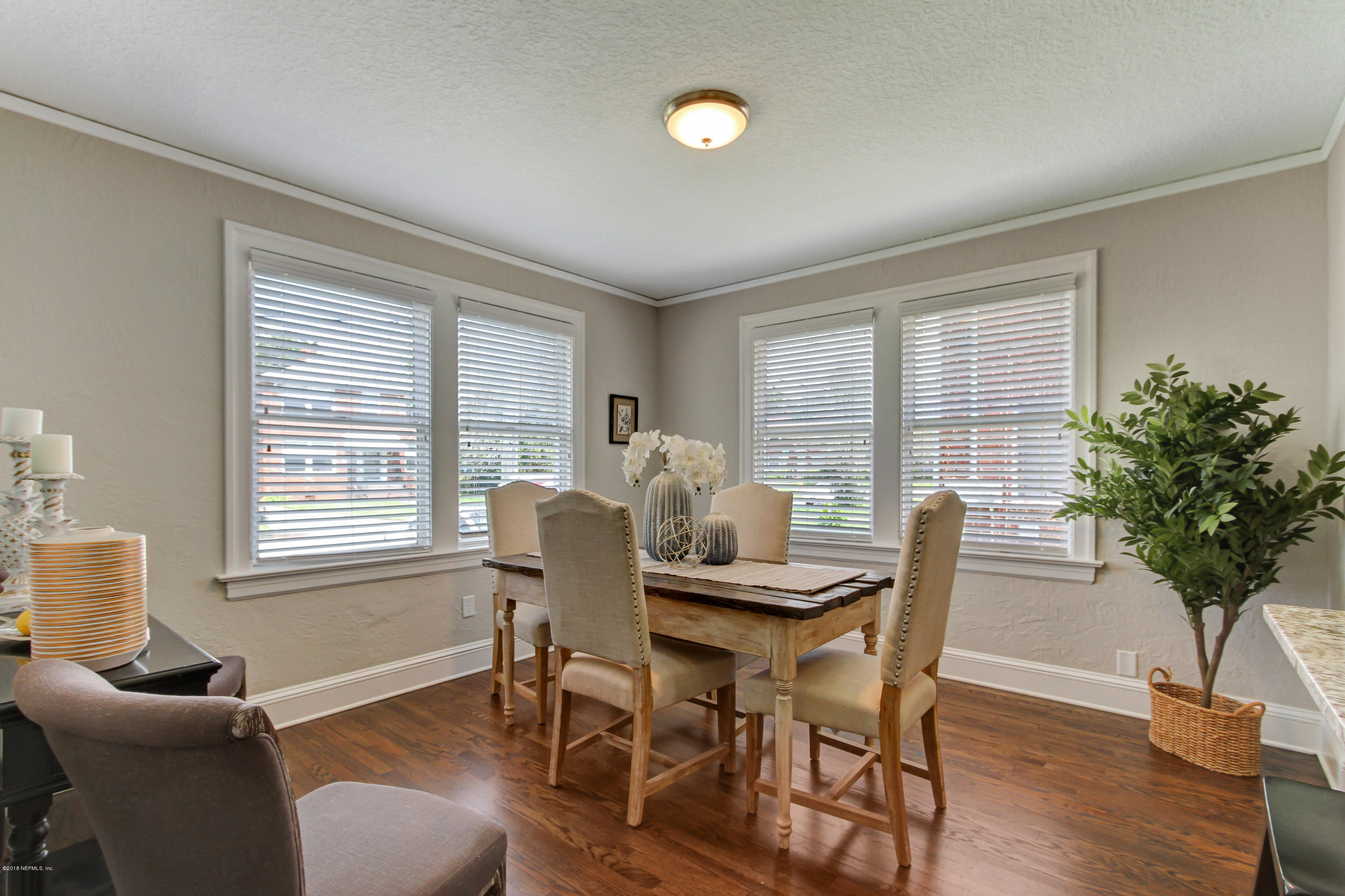 1026 Riviera Street Jacksonville, FL 32207 - Photo 24 of 48 a view of a dining room with furniture window and wooden floor