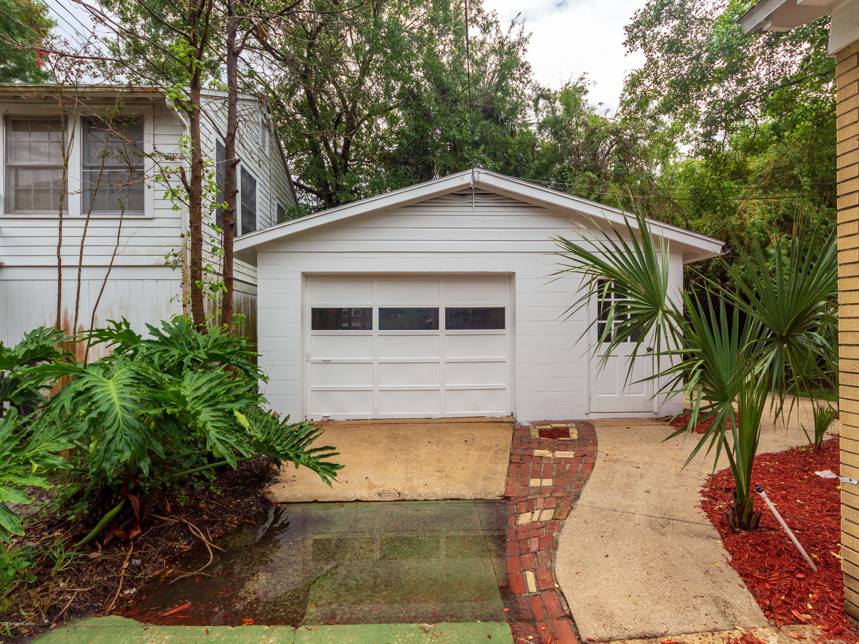 1026 Riviera Street Jacksonville, FL 32207 - Photo 25 of 48 a front view of a house with a yard