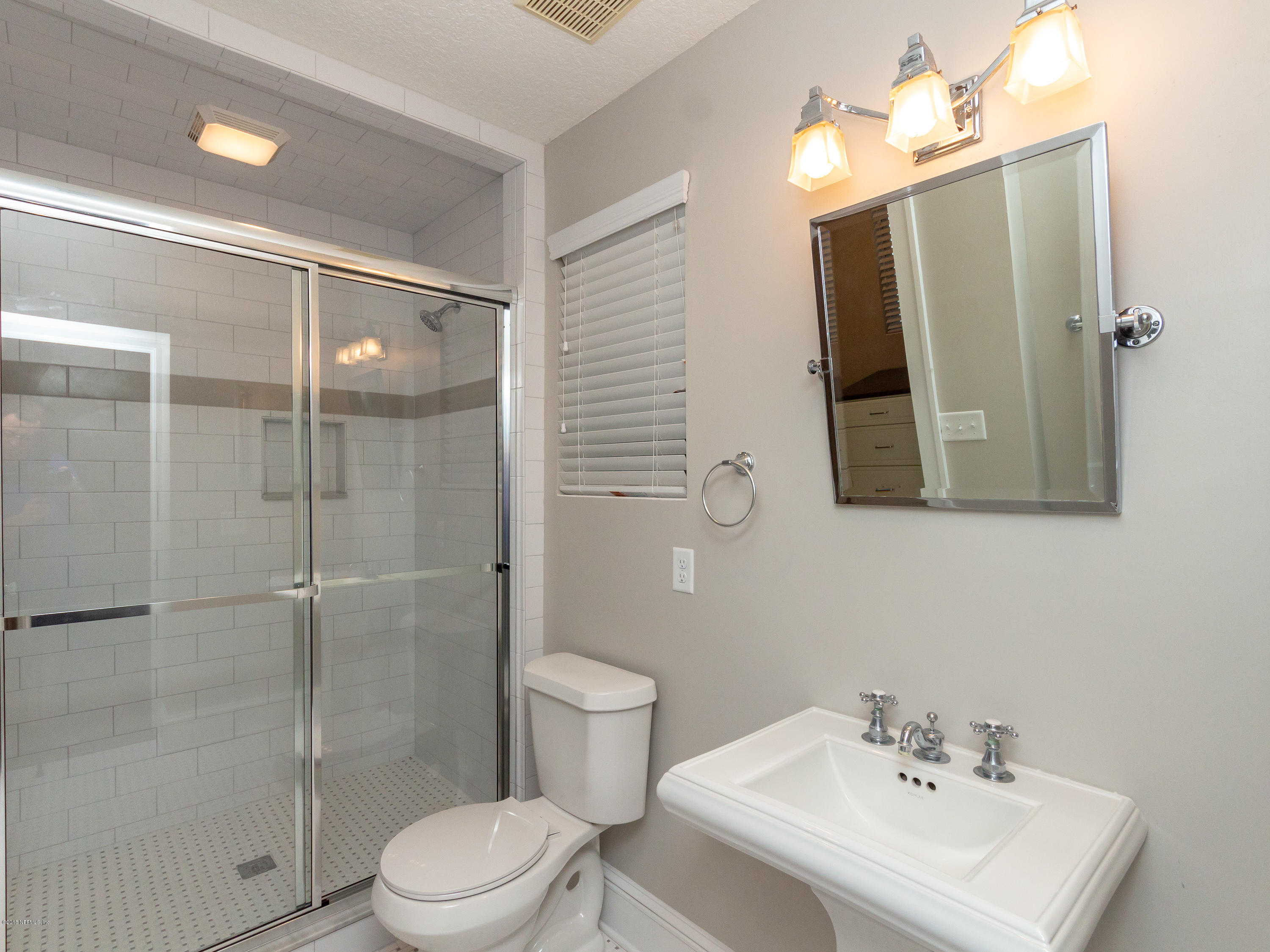 1026 Riviera Street Jacksonville, FL 32207 - Photo 29 of 48 a bathroom with a sink toilet and shower