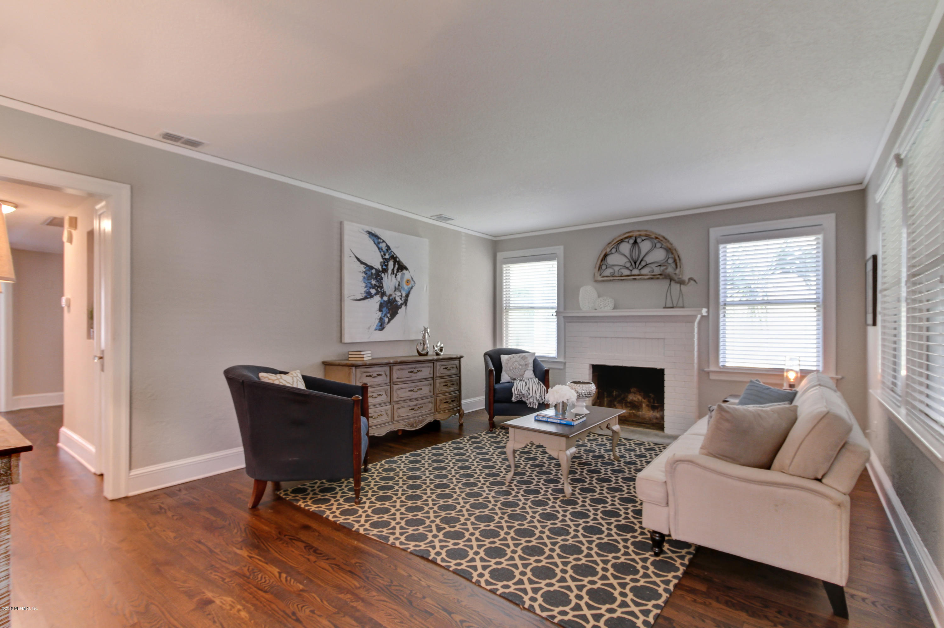 1026 Riviera Street Jacksonville, FL 32207 - Photo 3 of 48 a living room with furniture and a fireplace