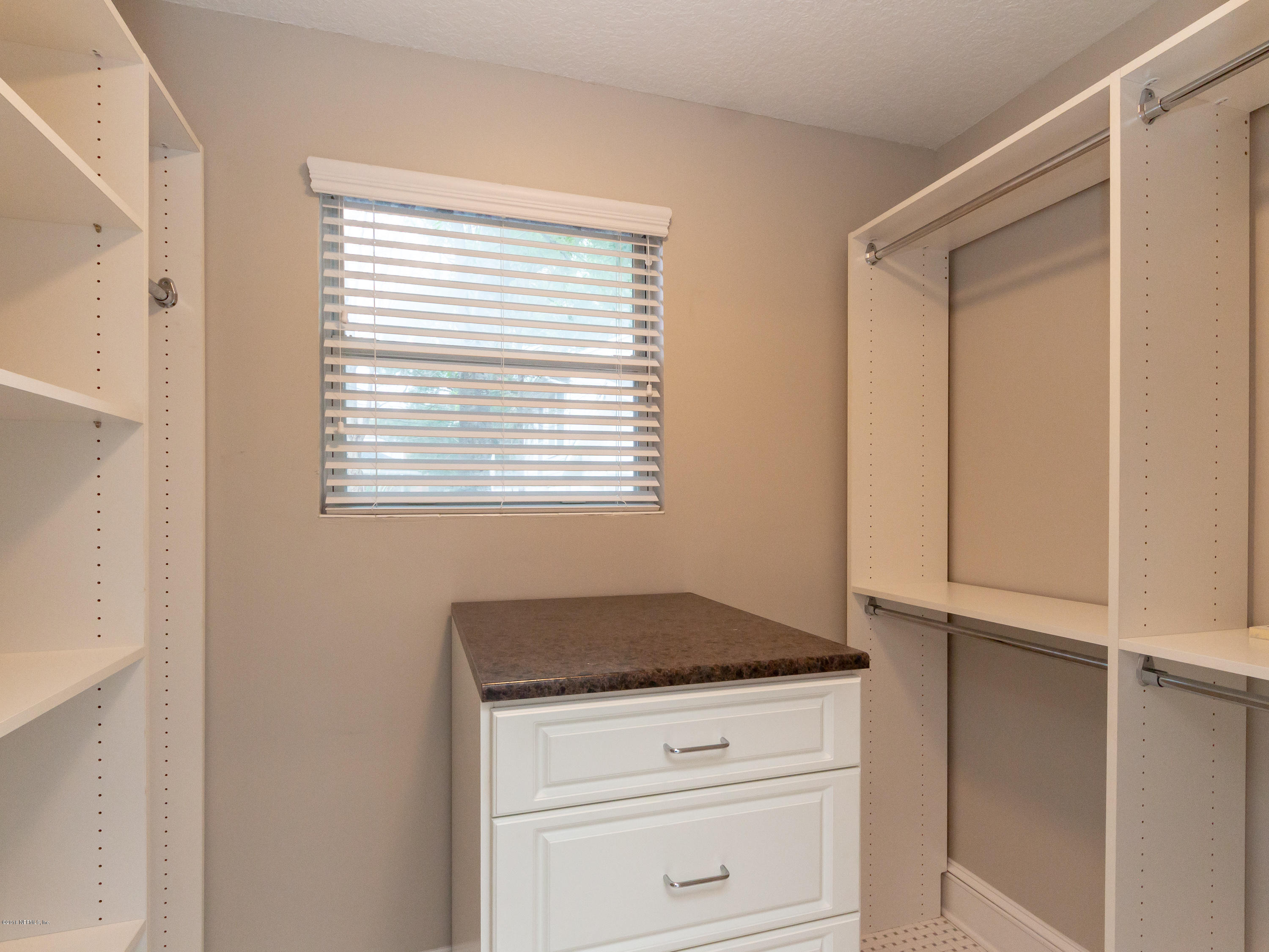 1026 Riviera Street Jacksonville, FL 32207 - Photo 31 of 48 a kitchen with granite countertop white cabinets and white appliances