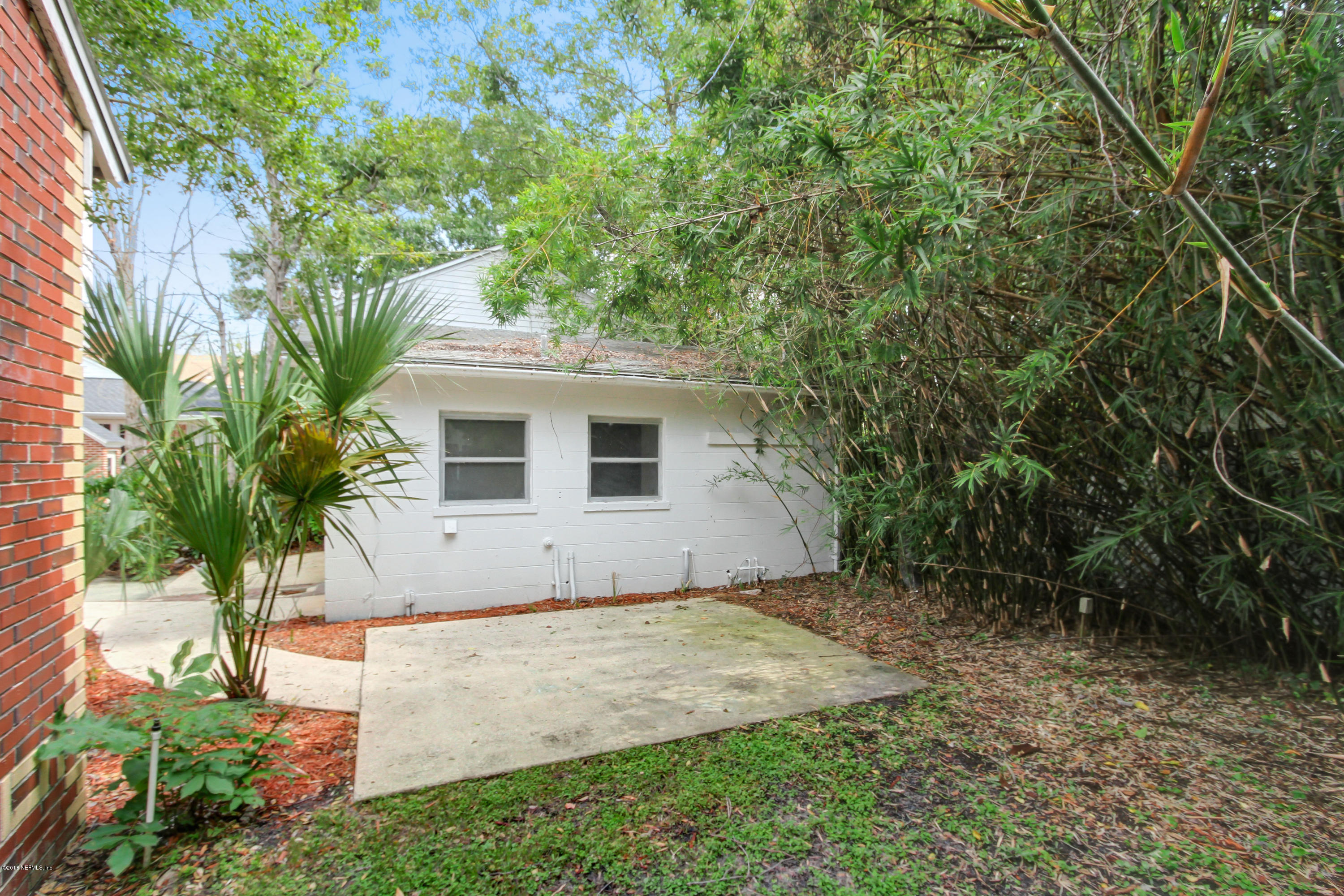 1026 Riviera Street Jacksonville, FL 32207 - Photo 32 of 48 a house with trees in front of it
