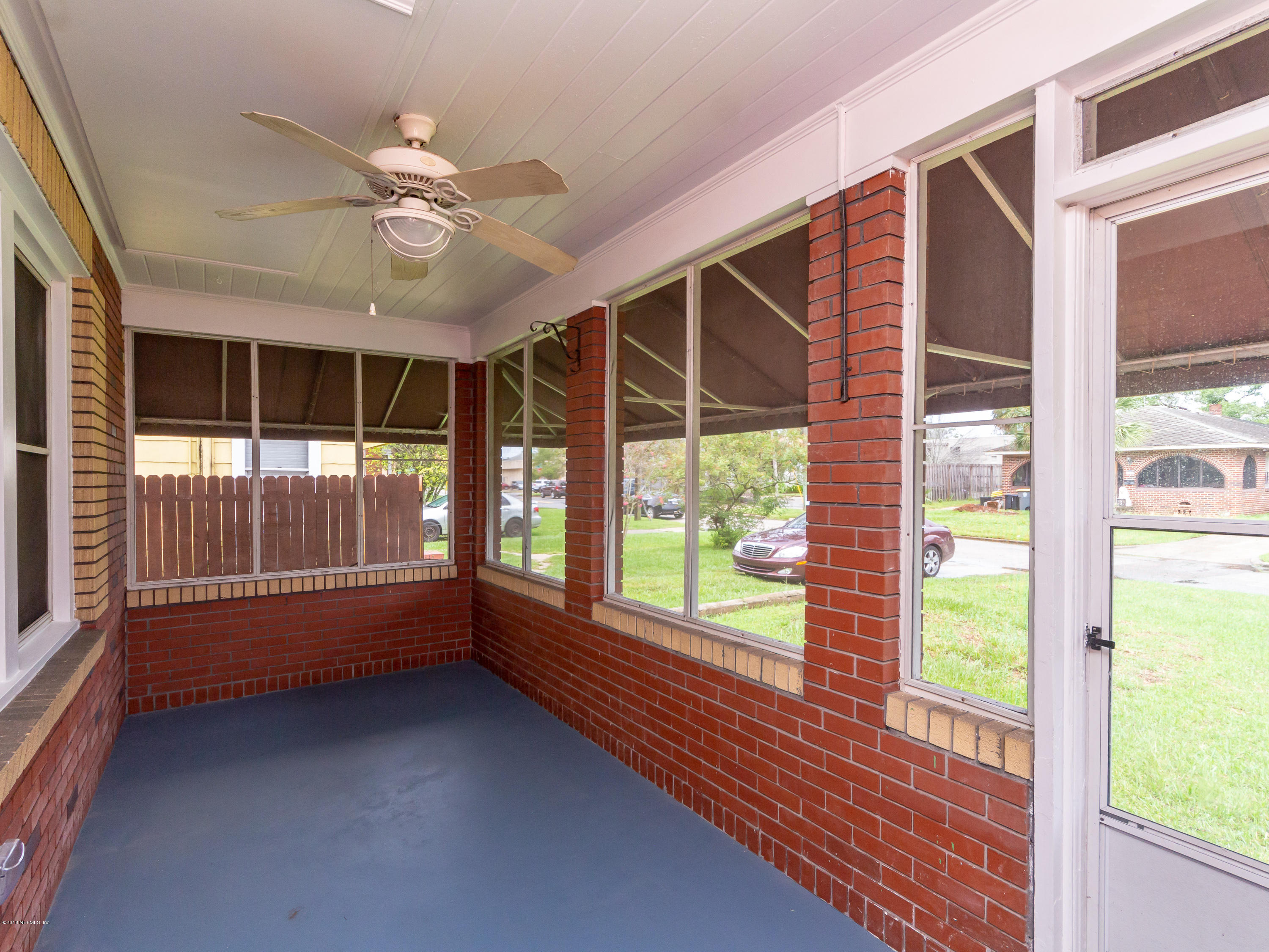 1026 Riviera Street Jacksonville, FL 32207 - Photo 34 of 48 a view of an empty room with wooden floor and a window