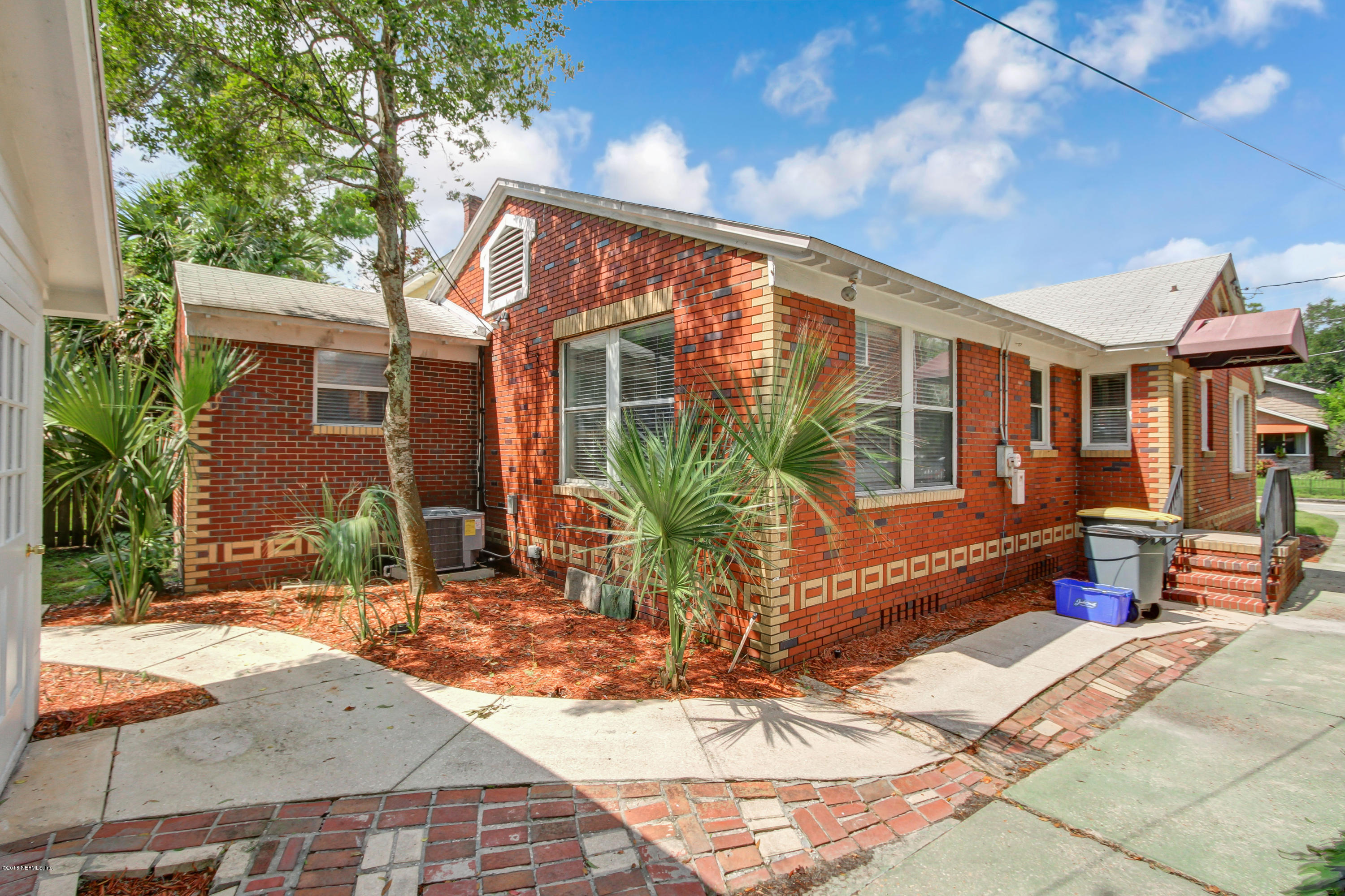 1026 Riviera Street Jacksonville, FL 32207 - Photo 35 of 48 a view of a house with backyard sitting area and garden