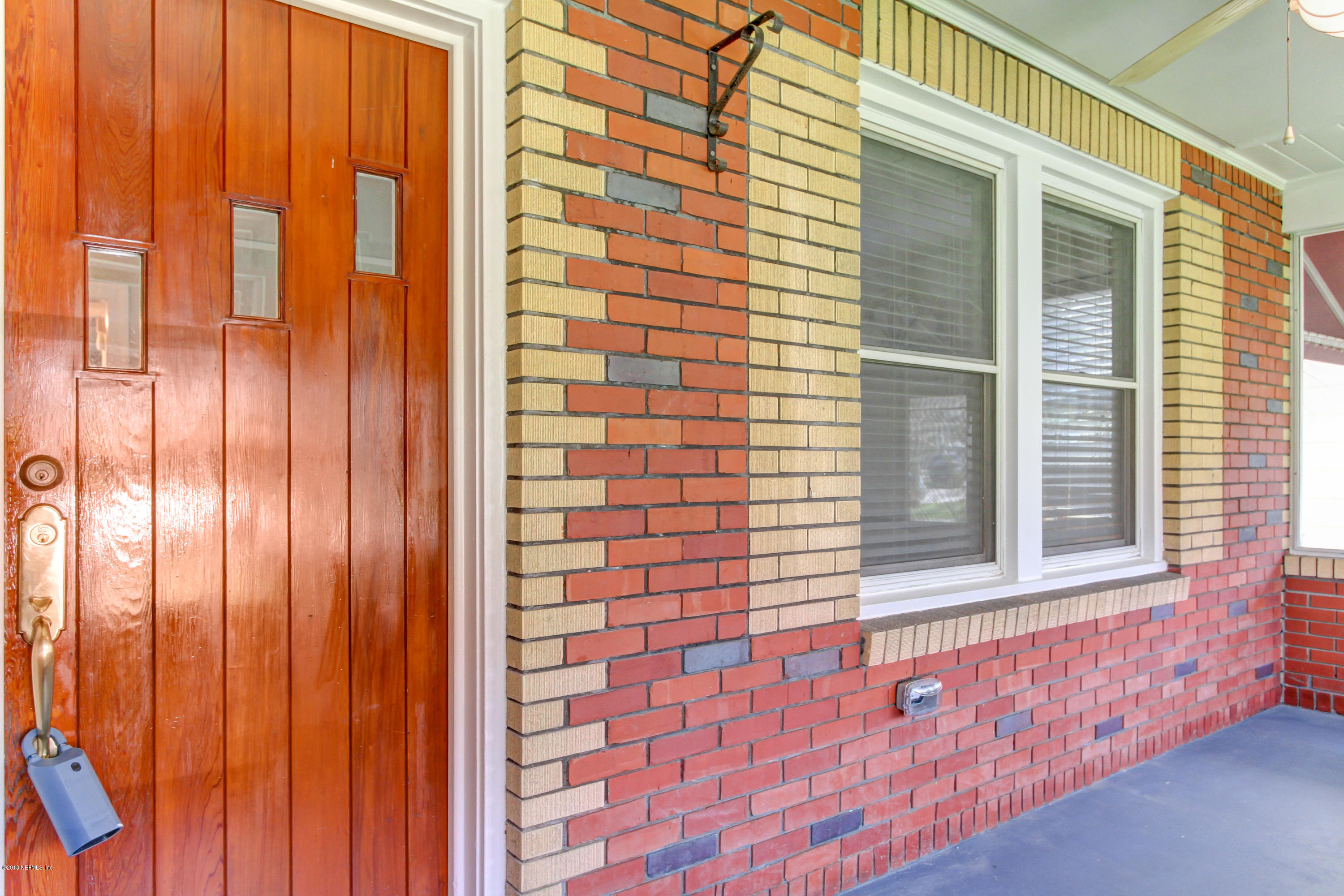 1026 Riviera Street Jacksonville, FL 32207 - Photo 40 of 48 a view of a brick wall with a large window