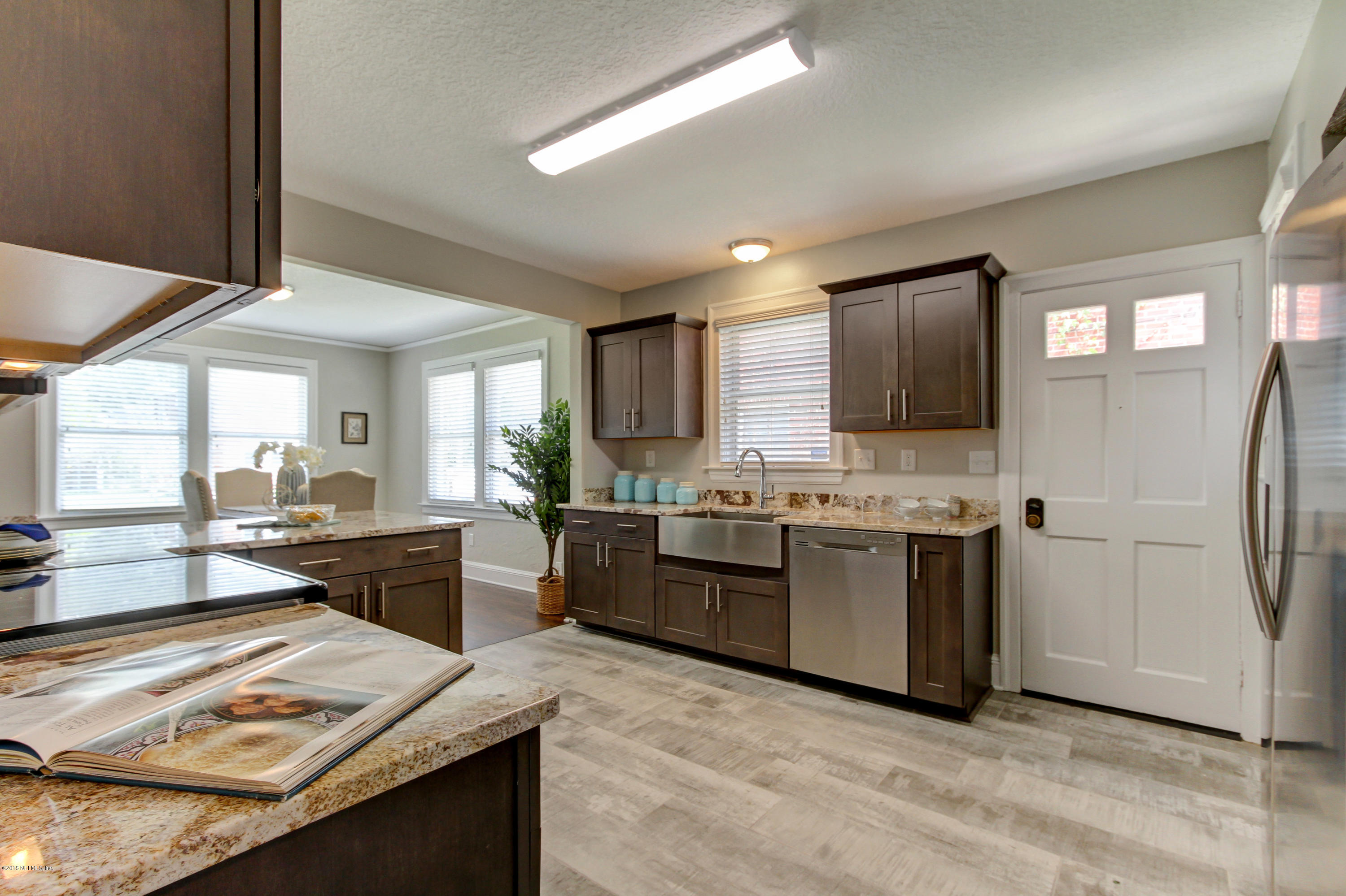 1026 Riviera Street Jacksonville, FL 32207 - Photo 5 of 48 a large kitchen with stainless steel appliances granite countertop a stove refrigerator and a sink