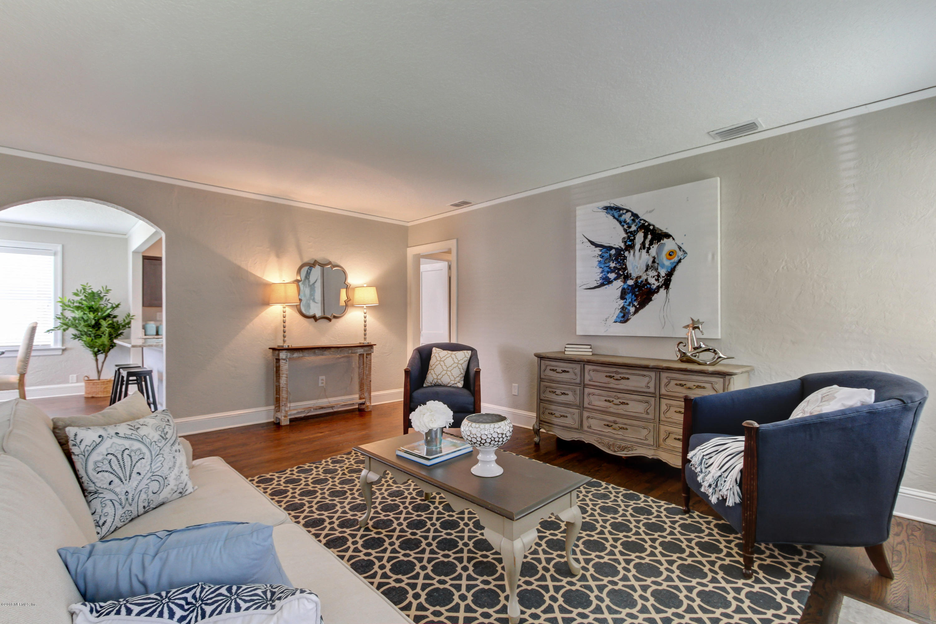 1026 Riviera Street Jacksonville, FL 32207 - Photo 6 of 48 a living room with furniture rug and chair