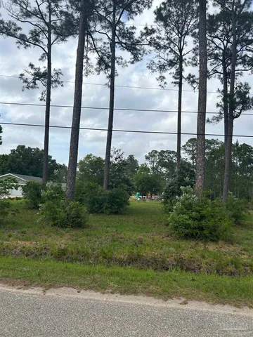 a view of lake with a big yard