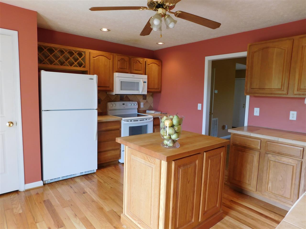 154 Raintree Road Verona, VA 24482 - Photo 12 of 49 a kitchen with kitchen island a counter top space appliances and cabinets