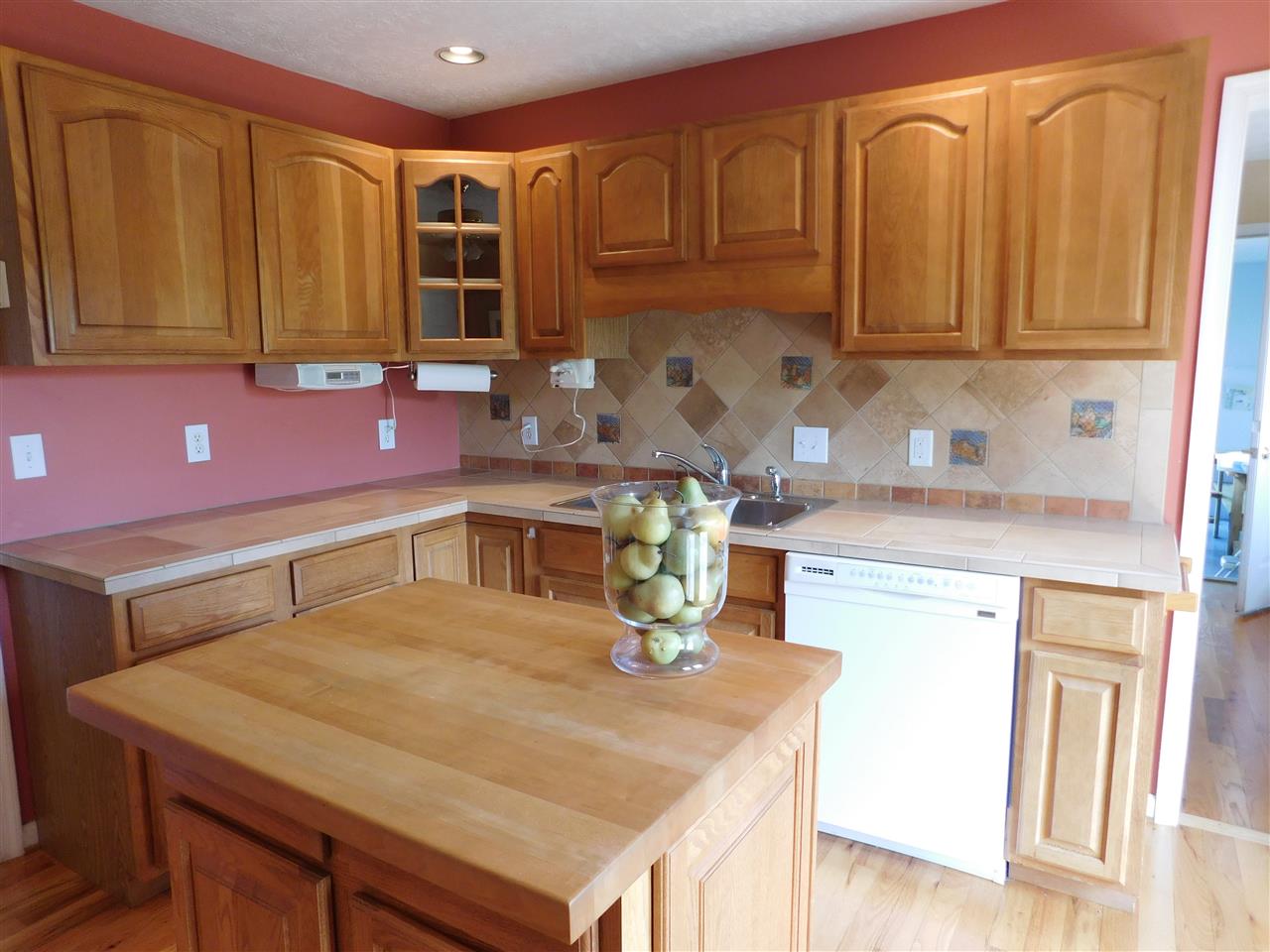 154 Raintree Road Verona, VA 24482 - Photo 16 of 49 a kitchen with stainless steel appliances wooden cabinets and a refrigerator