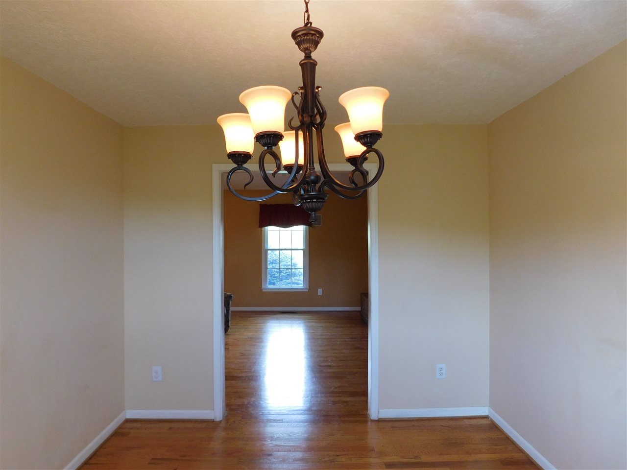 154 Raintree Road Verona, VA 24482 - Photo 19 of 49 a view of a room with wooden floor chandelier