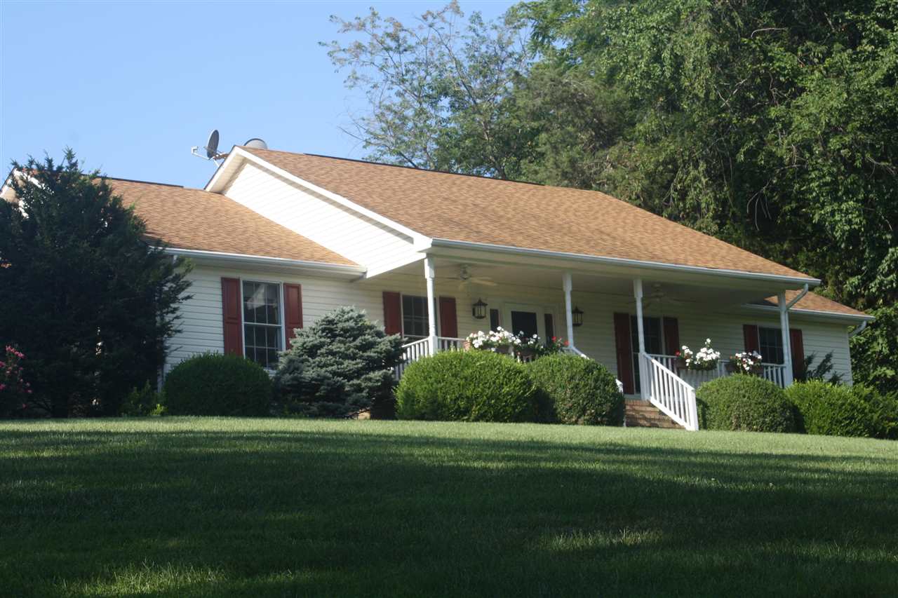 154 Raintree Road Verona, VA 24482 - Photo 2 of 49 a front view of a house with a garden
