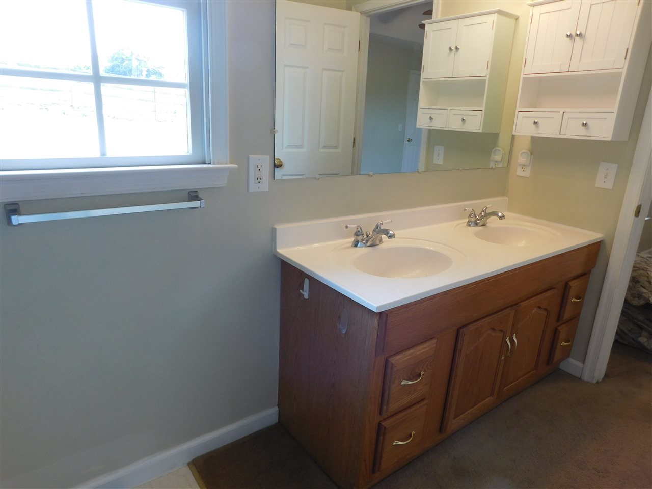 154 Raintree Road Verona, VA 24482 - Photo 26 of 49 a bathroom with a sink and a mirror