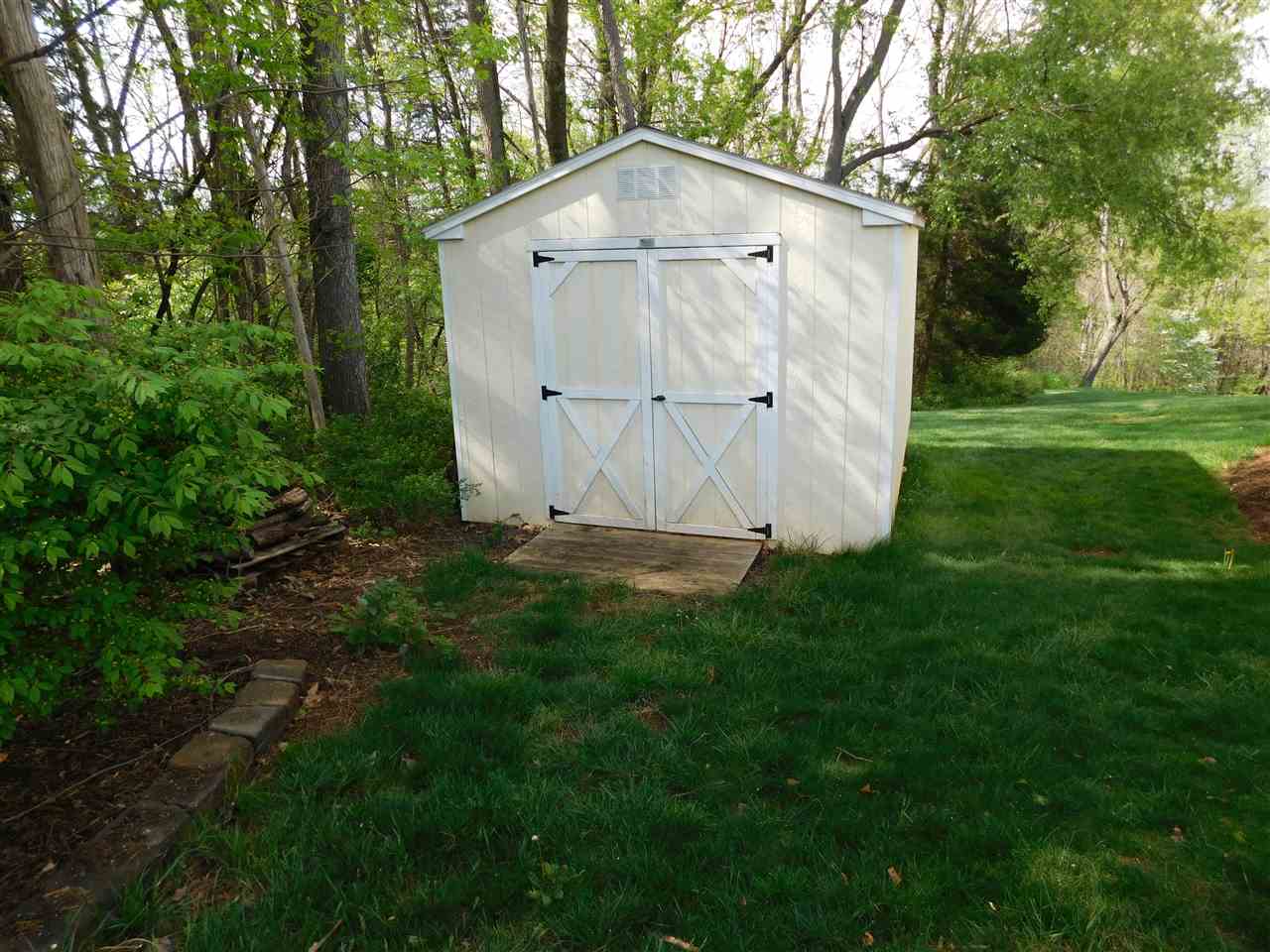 154 Raintree Road Verona, VA 24482 - Photo 34 of 49 a view of backyard with large garden and wooden fence