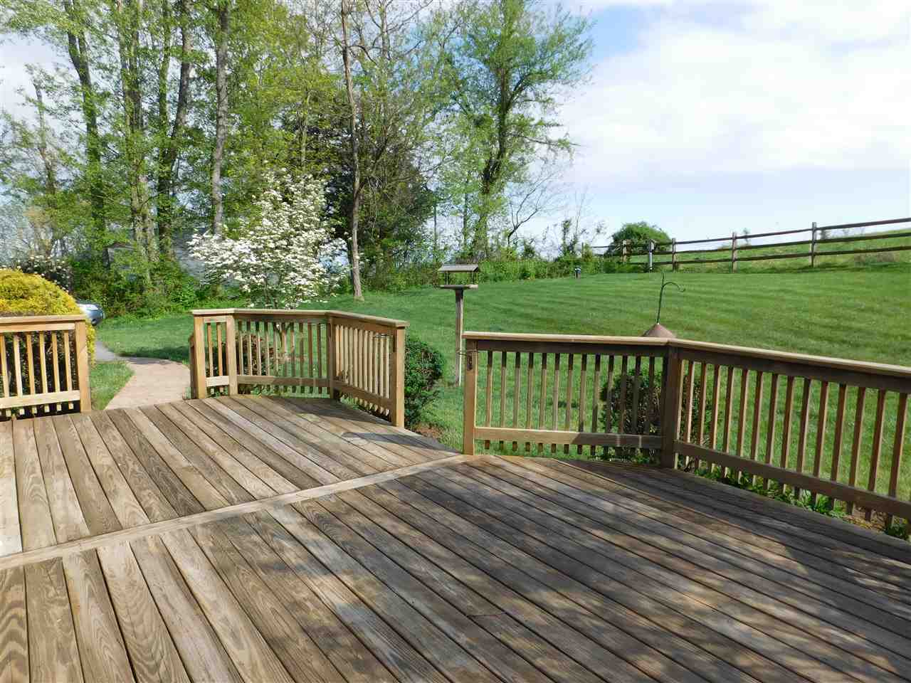 154 Raintree Road Verona, VA 24482 - Photo 42 of 49 a view of a wooden deck with a yard