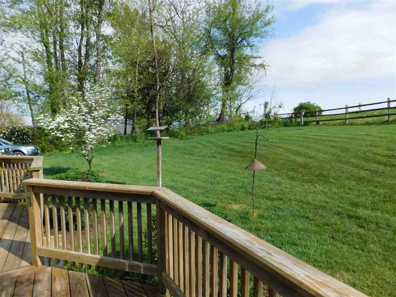 154 Raintree Road Verona, VA 24482 - Photo 44 of 49 a view of a wooden deck and grass