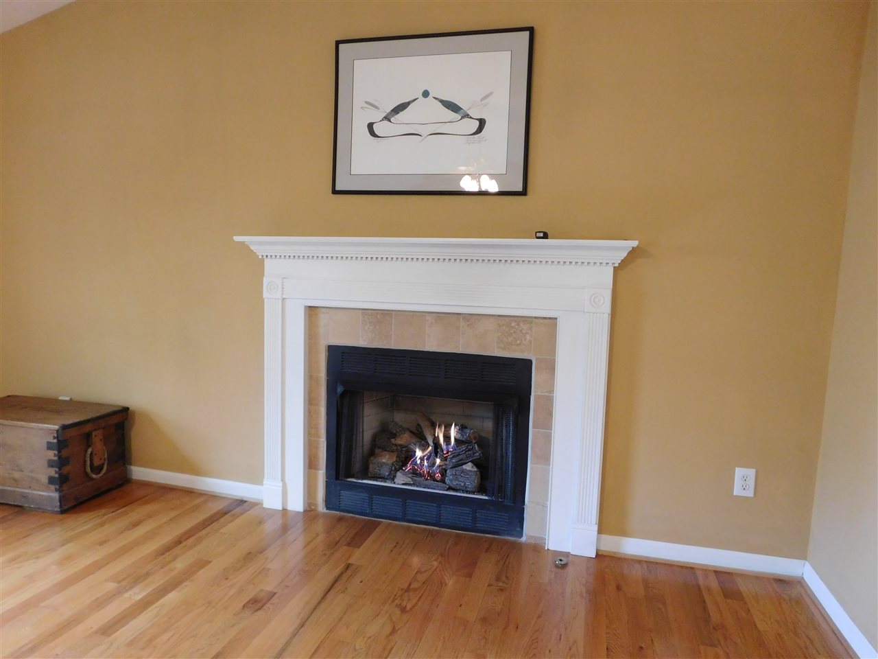 154 Raintree Road Verona, VA 24482 - Photo 7 of 49 a view of an empty room with wooden floor and a fireplace