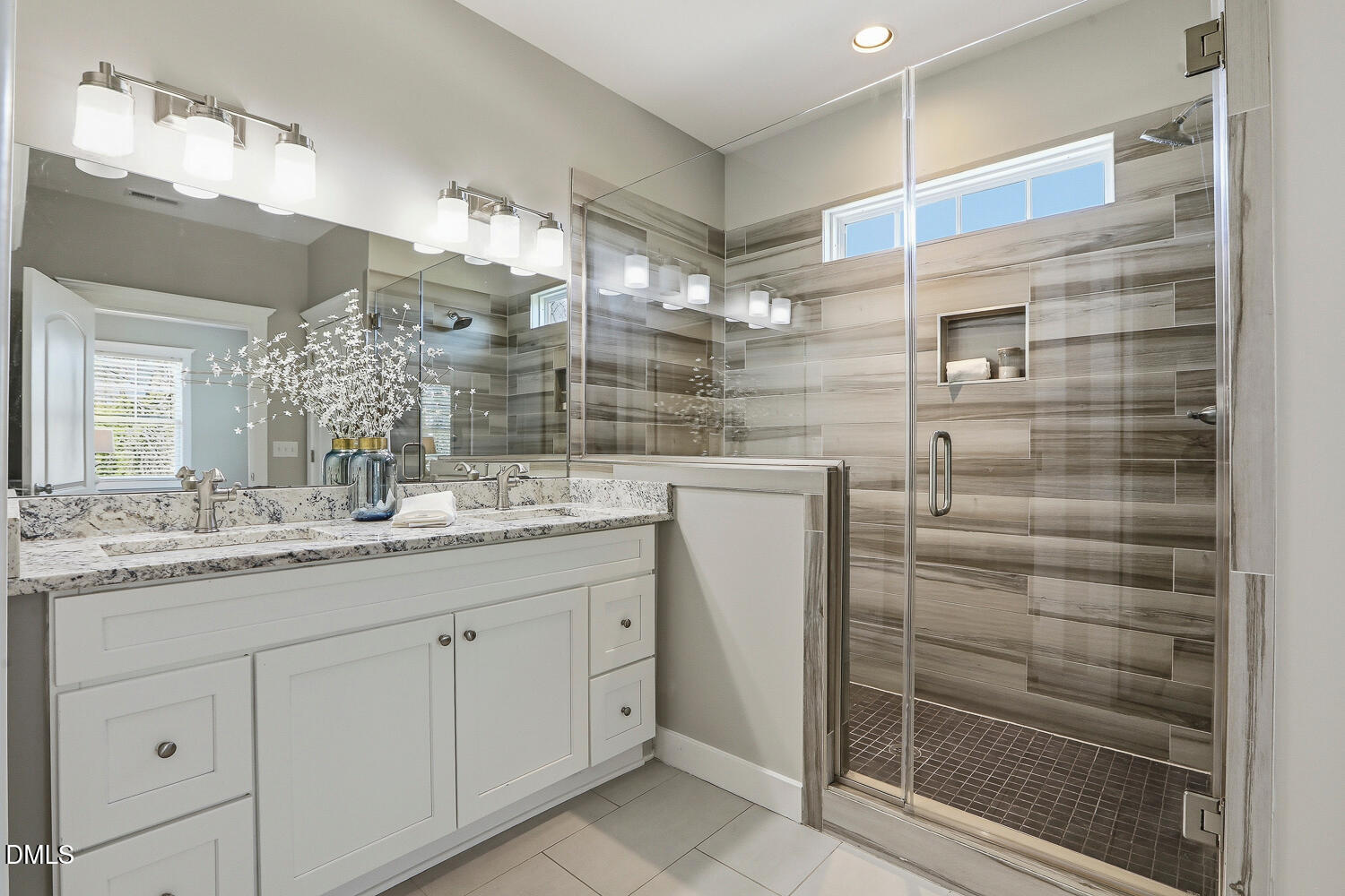 1605 Boyer Street Raleigh, NC 27610 - Photo 20 of 38 a bathroom with a shower sink and mirror