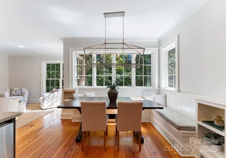 a view of a dining room with furniture and a table