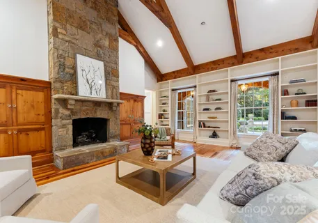 a view of two chairs in the balcony