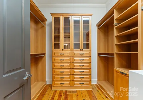 a bathroom with a tub a sink and a large mirror