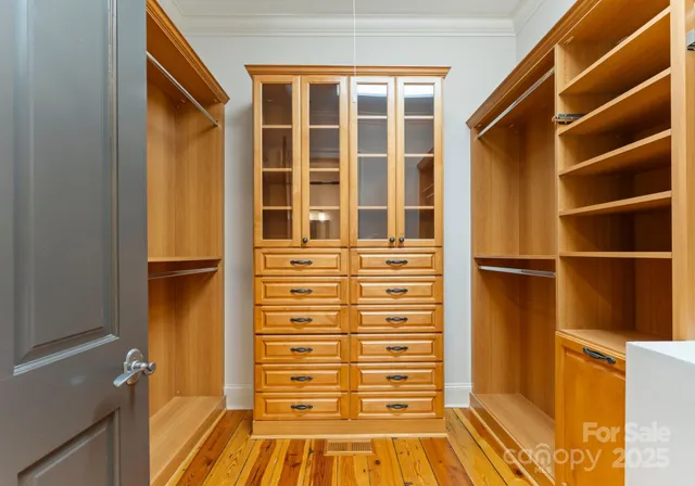 a bathroom with a tub a sink and a large mirror