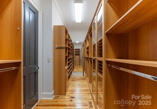 a view of a bedroom with a tub and window