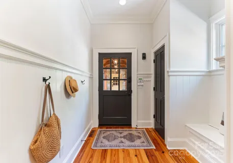 a lobby with furniture and window