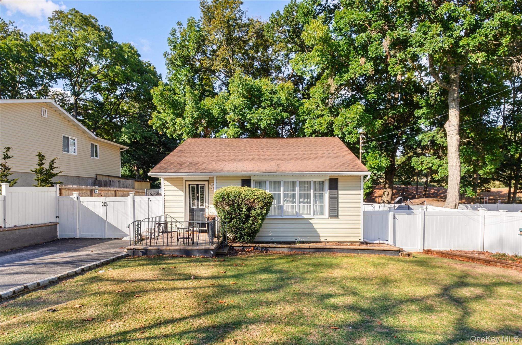 a view of a house with pool and sitting area
