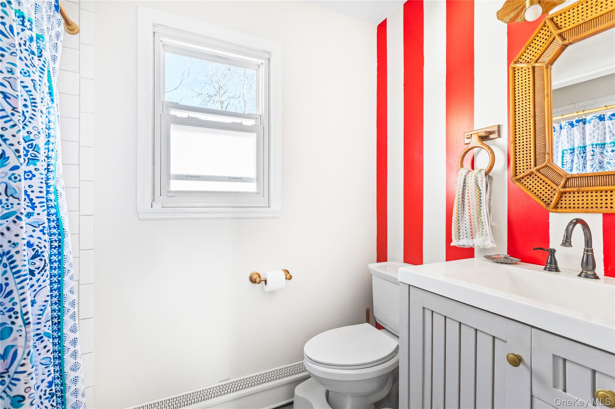 193 Maple Road Wading River, NY 11792 - Photo 11 of 17 a bathroom with a sink and a toilet