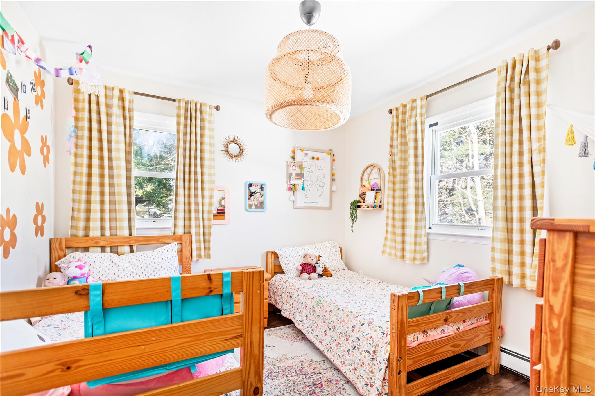 193 Maple Road Wading River, NY 11792 - Photo 12 of 17 a bedroom with a bed and wooden floor