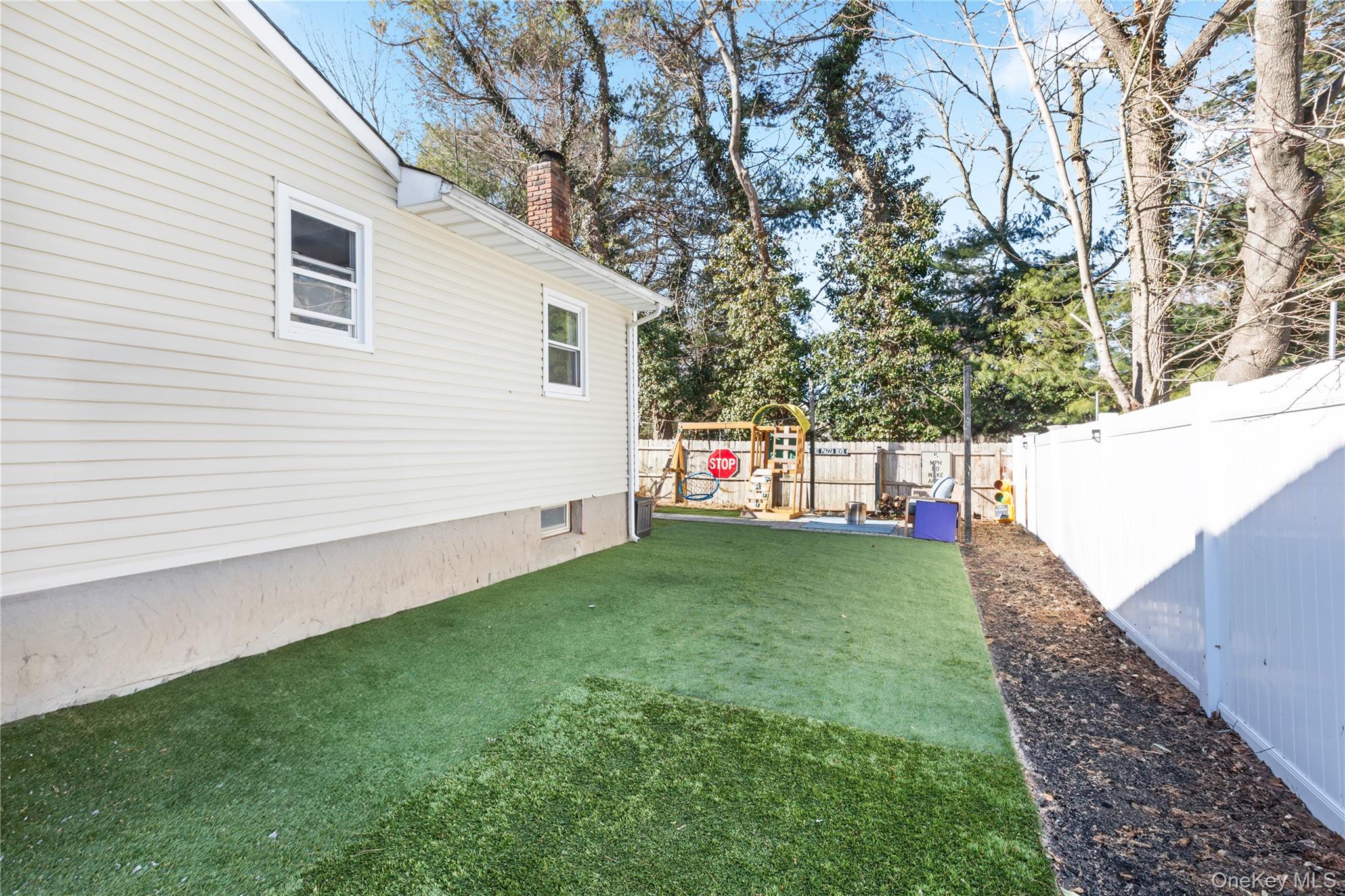 193 Maple Road Wading River, NY 11792 - Photo 15 of 17 a view of a back yard of the house