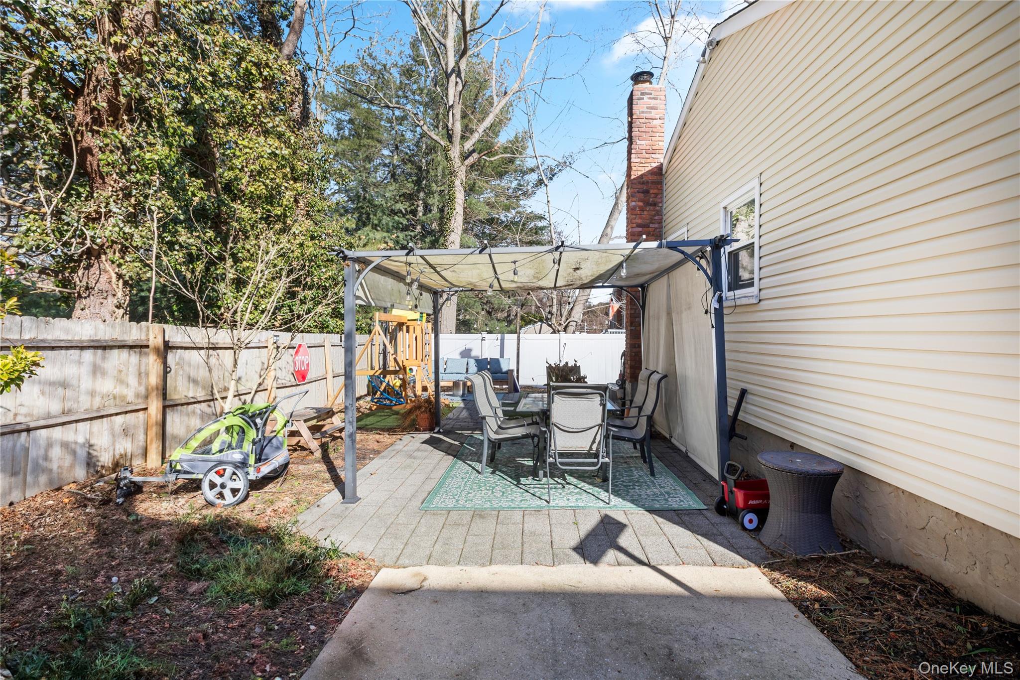 193 Maple Road Wading River, NY 11792 - Photo 17 of 17 a view of a patio with table and chairs and potted plants