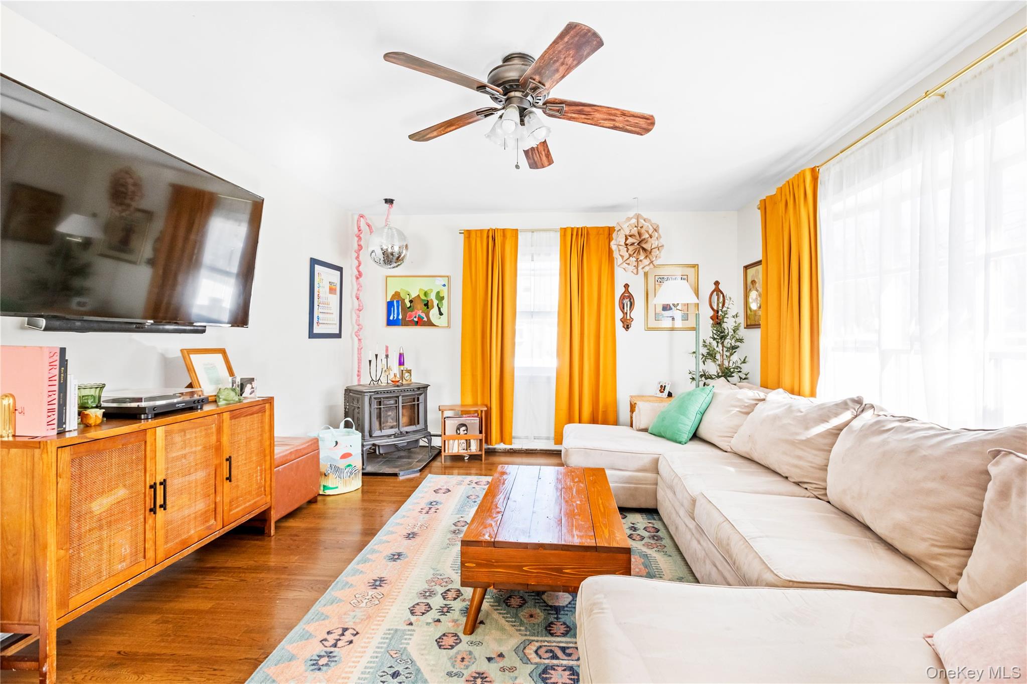 193 Maple Road Wading River, NY 11792 - Photo 3 of 17 a living room with furniture and a flat screen tv