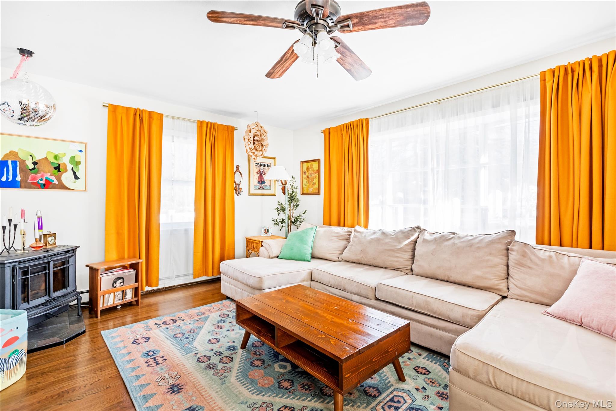 193 Maple Road Wading River, NY 11792 - Photo 4 of 17 a living room with furniture and a large window