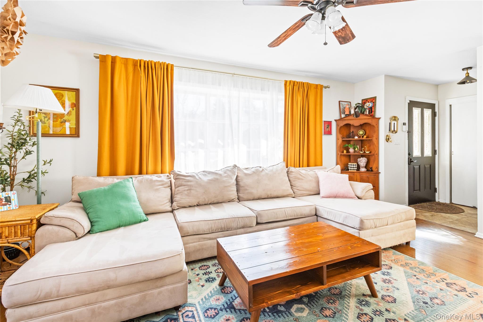 193 Maple Road Wading River, NY 11792 - Photo 5 of 17 a living room with furniture and a large window