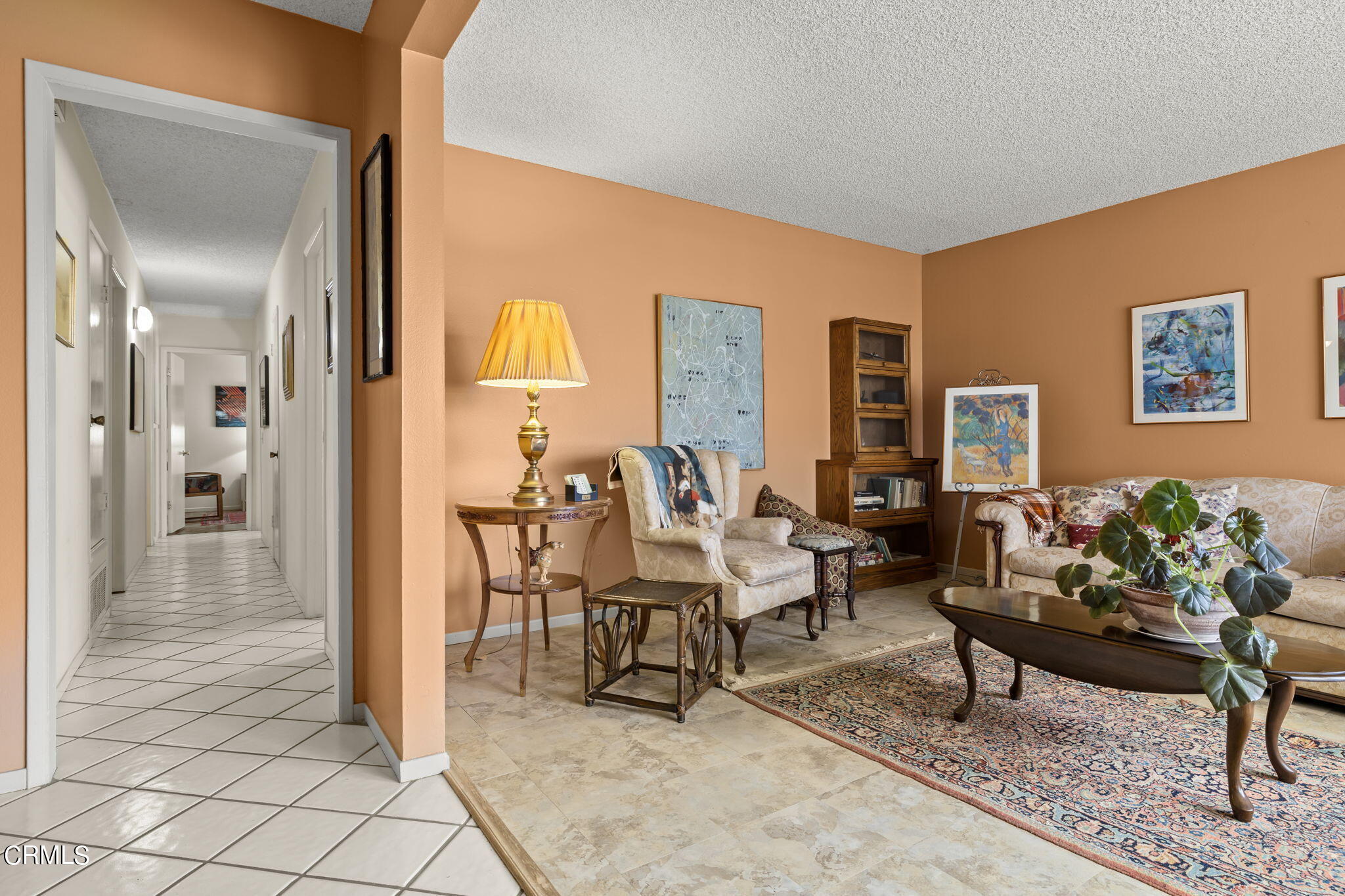 2072 Olga Street Oxnard, CA 93036 - Photo 4 of 18 a living room with furniture and a dining table