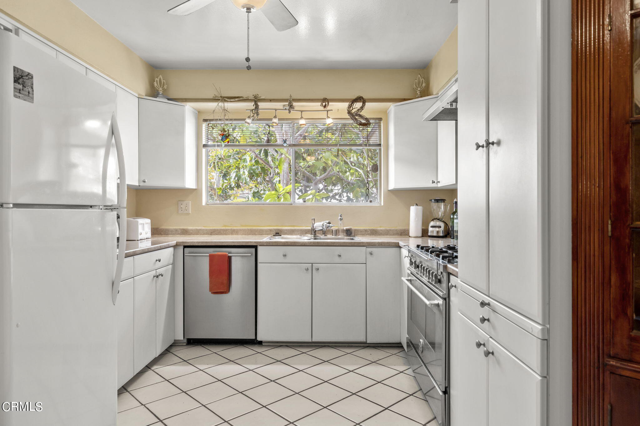 2072 Olga Street Oxnard, CA 93036 - Photo 6 of 18 a utility room with cabinets washer and dryer