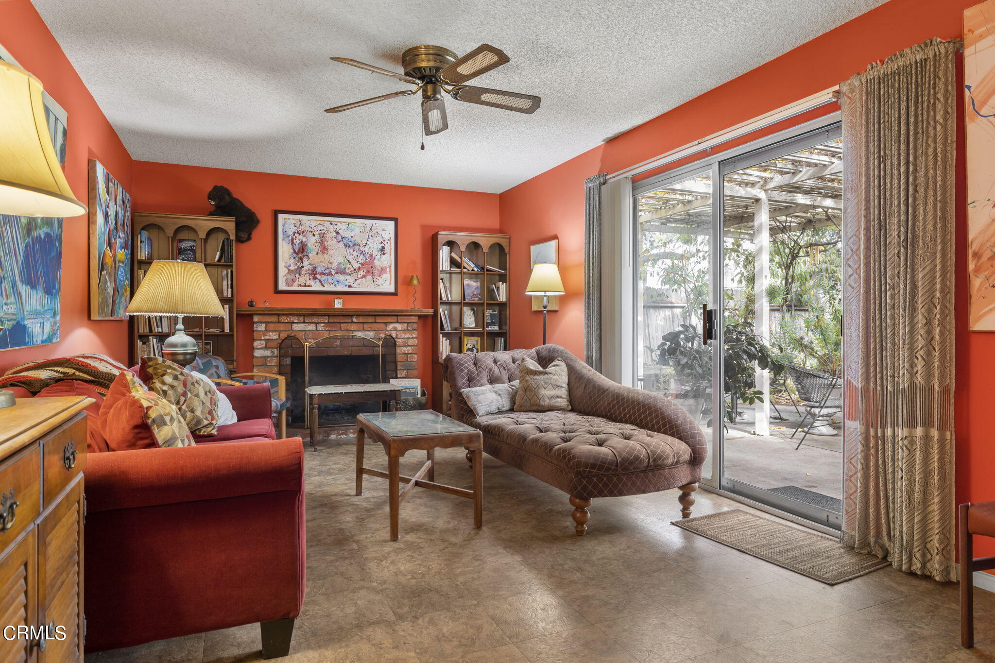 2072 Olga Street Oxnard, CA 93036 - Photo 7 of 18 a living room with furniture a flat screen tv and a large window