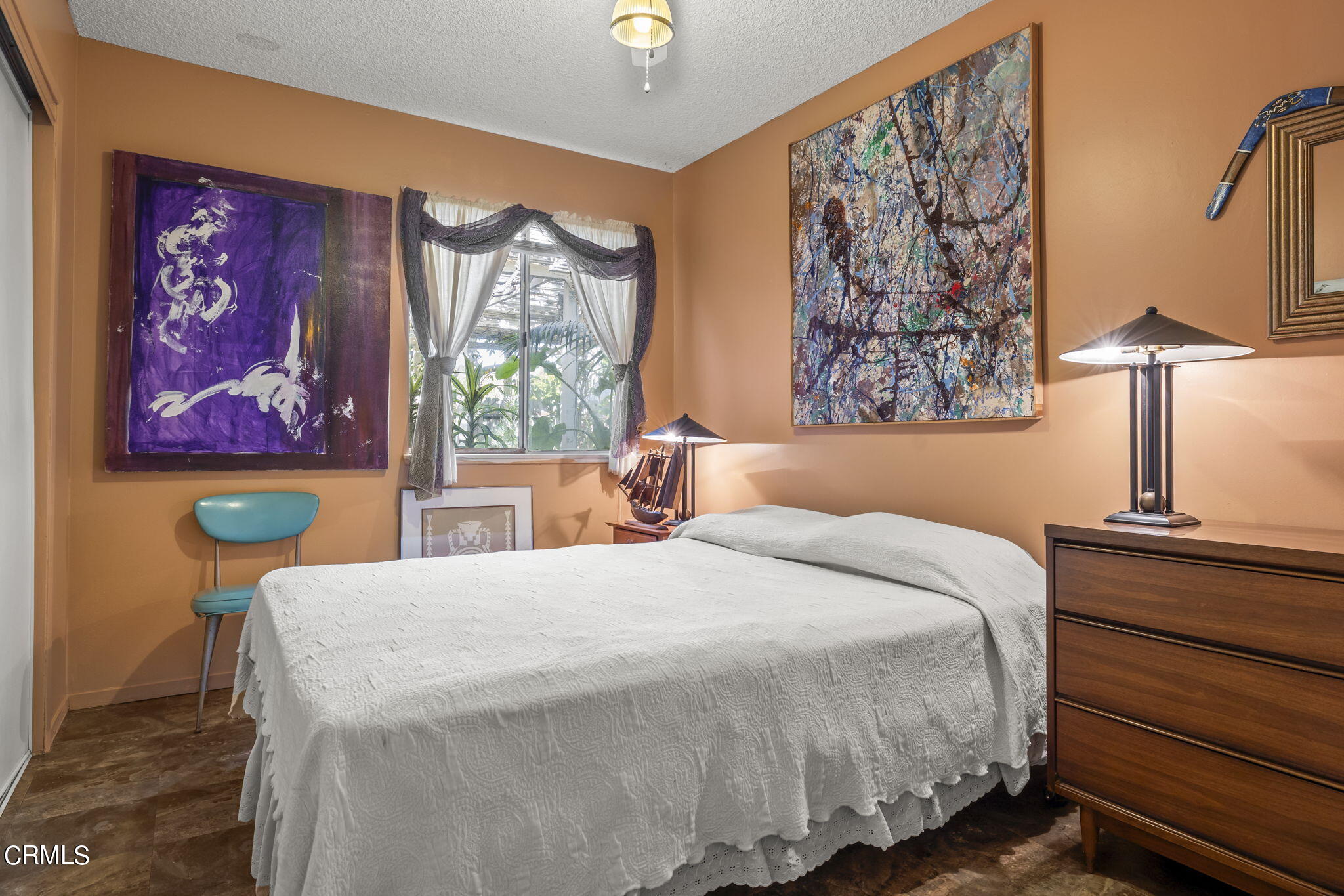 2072 Olga Street Oxnard, CA 93036 - Photo 10 of 18 a bedroom with a bed and a painting on the wall